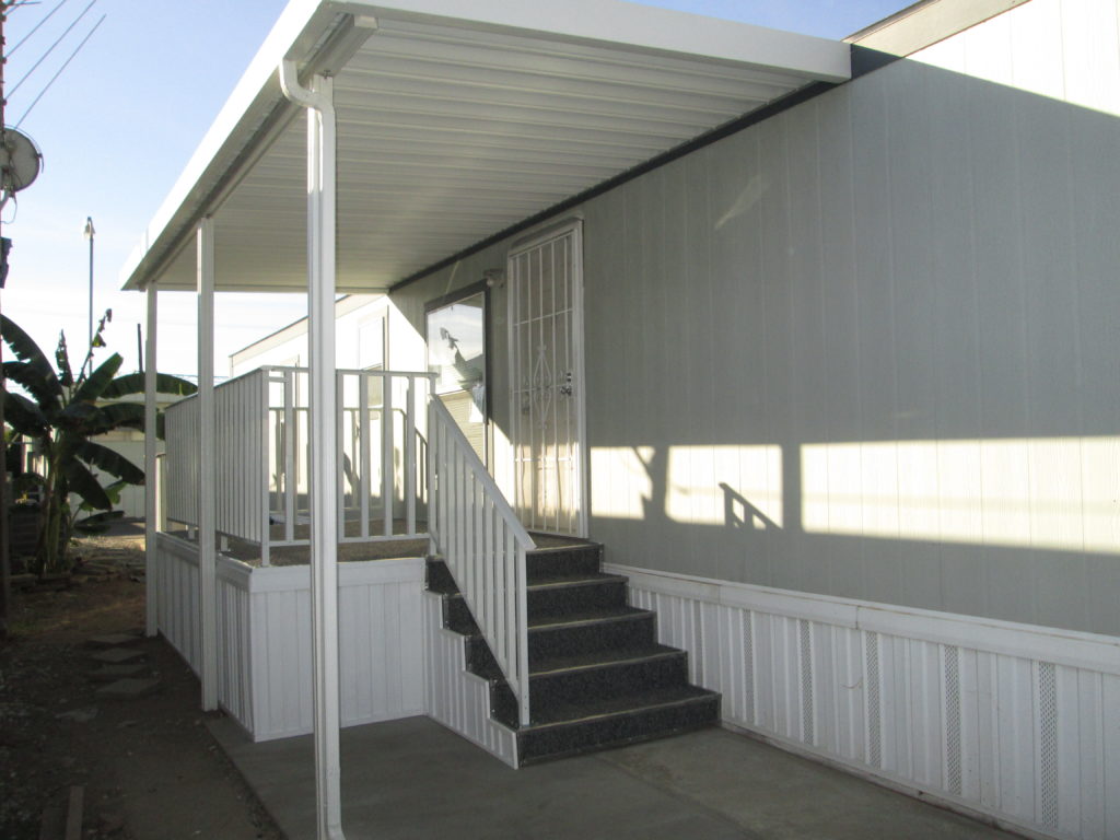 Image of the front porch and awning of a mobile home